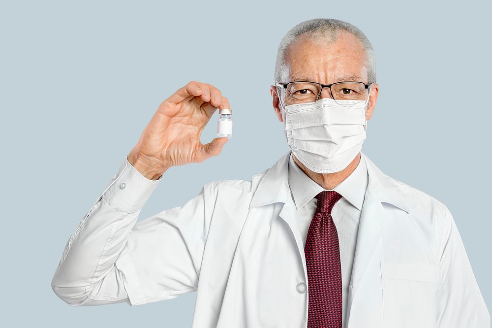 Male doctor mockup psd holding a vaccine bottle
