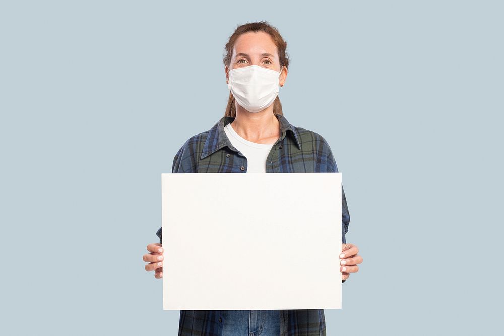 Sign board mockup psd with a woman wearing a face mask