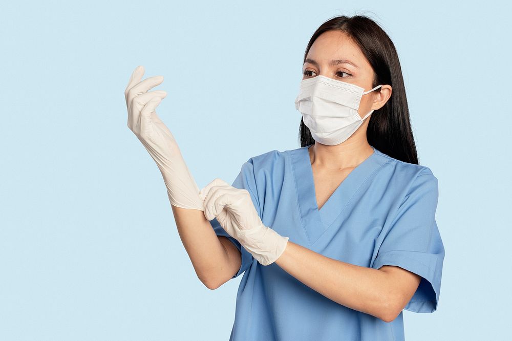 Female doctor wearing medical gloves