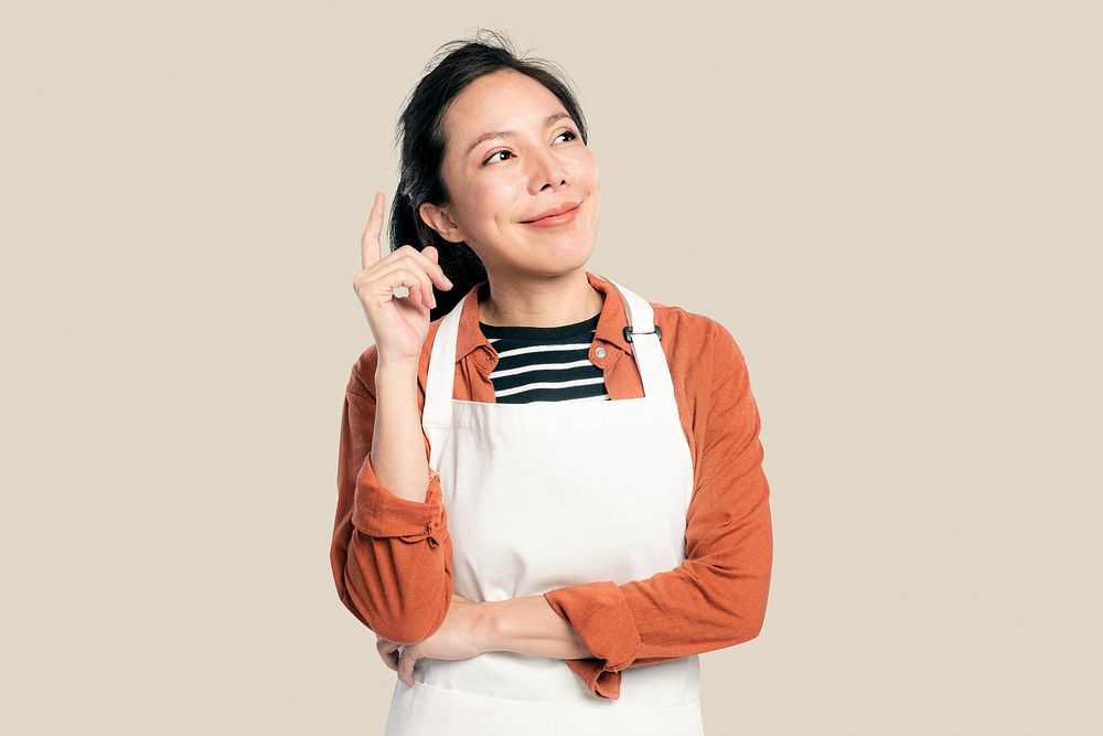 Cheerful Asian woman mockup psd  in an apron