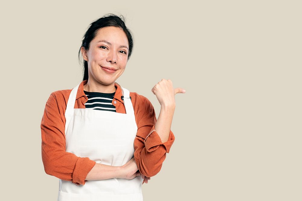 Cheerful Asian woman mockup psd  in an apron
