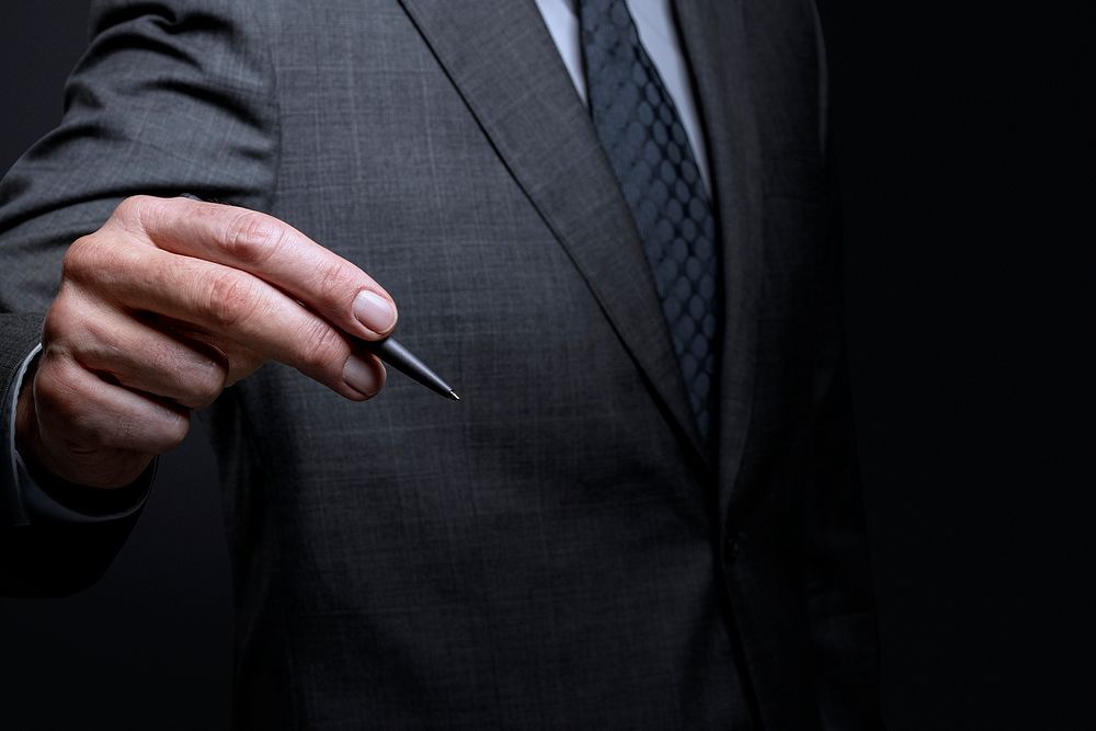 Businessman gesture mockup psd using a pen and writing on an invisible screen