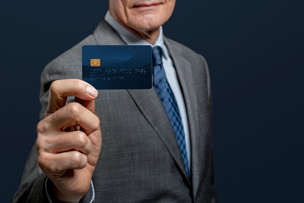 Credit card mockup psd presented by a businessman