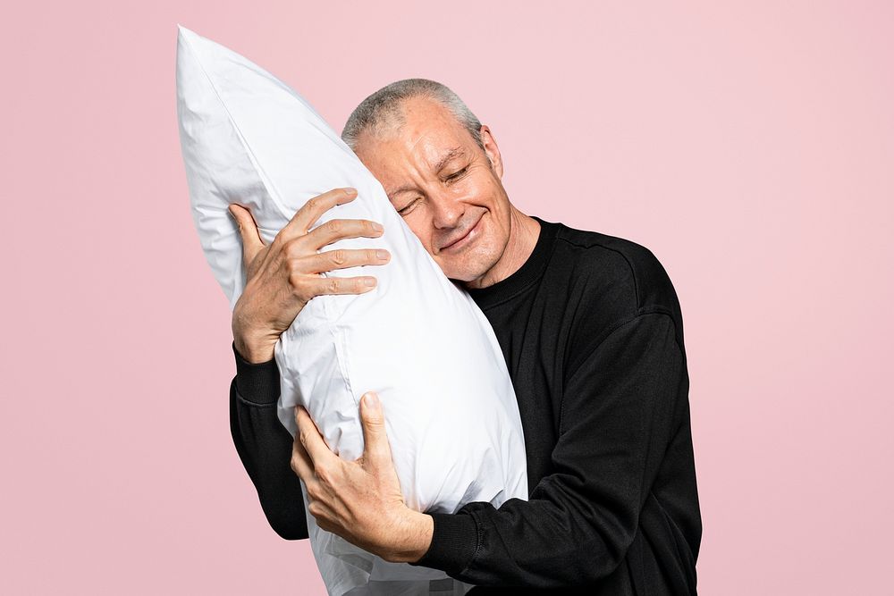Old man mockup psd hugging a pillow