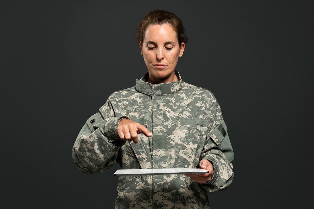 Female soldier mockup psd pressing index finger on an tablet screen