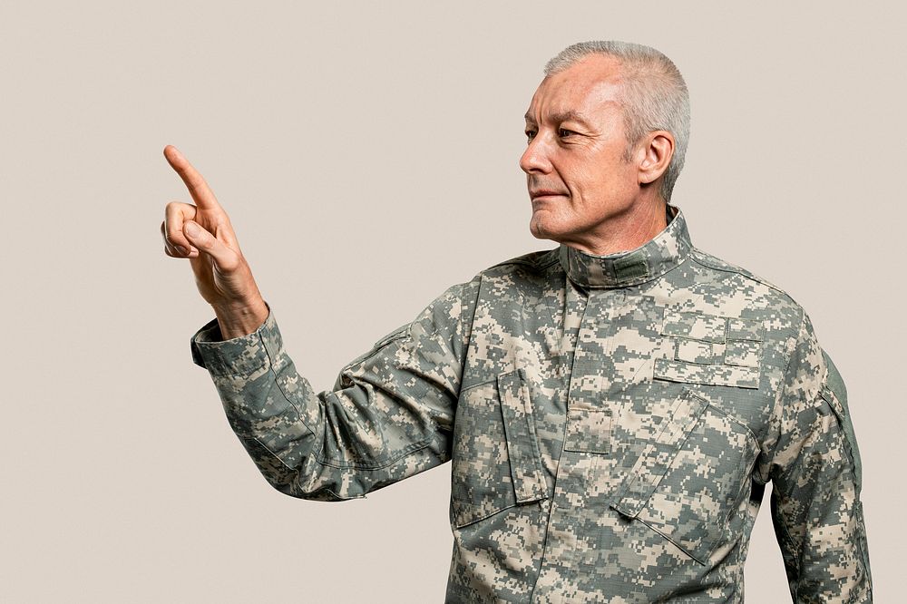 Male soldier pressing index finger on an invisible screen