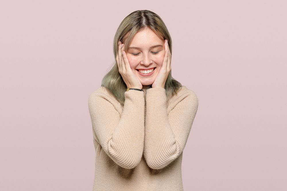 Happy woman in a beige sweater