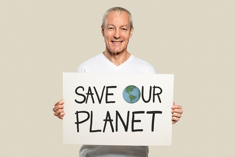 Man holding a save our planet placard