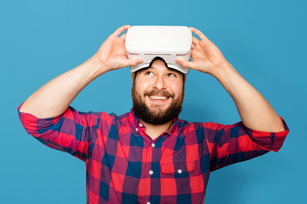 Bearded man wearing VR headset digital device