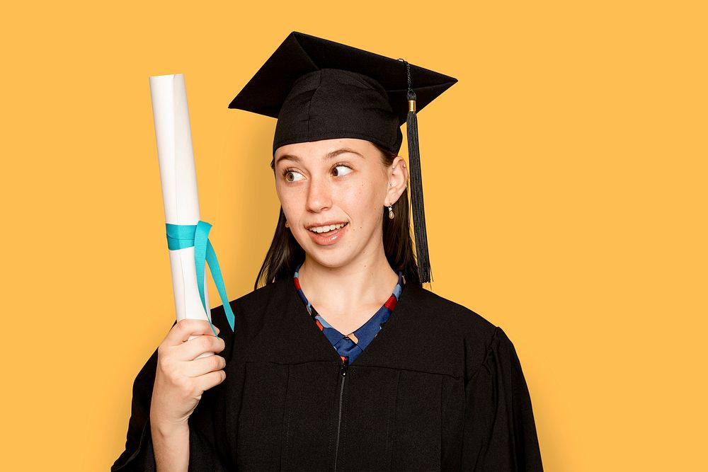 Woman wearing regalia mockup psd holding her degree for graduation