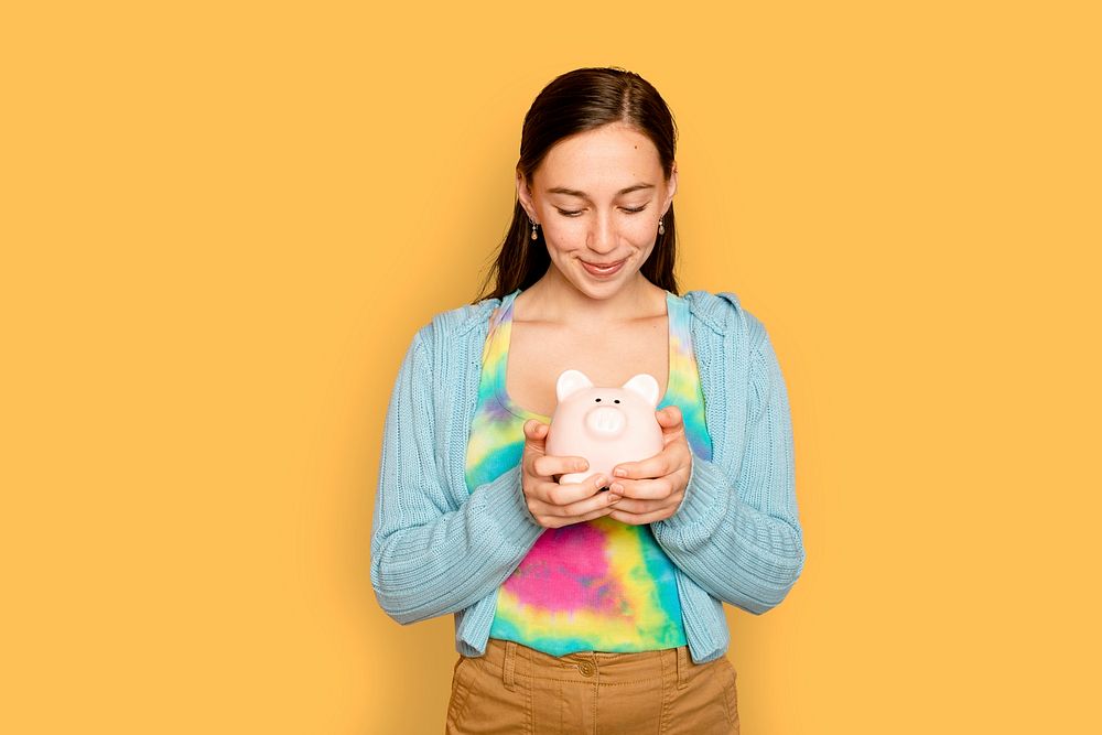 Beautiful woman mockup psd holding piggy bank for financial savings campaign