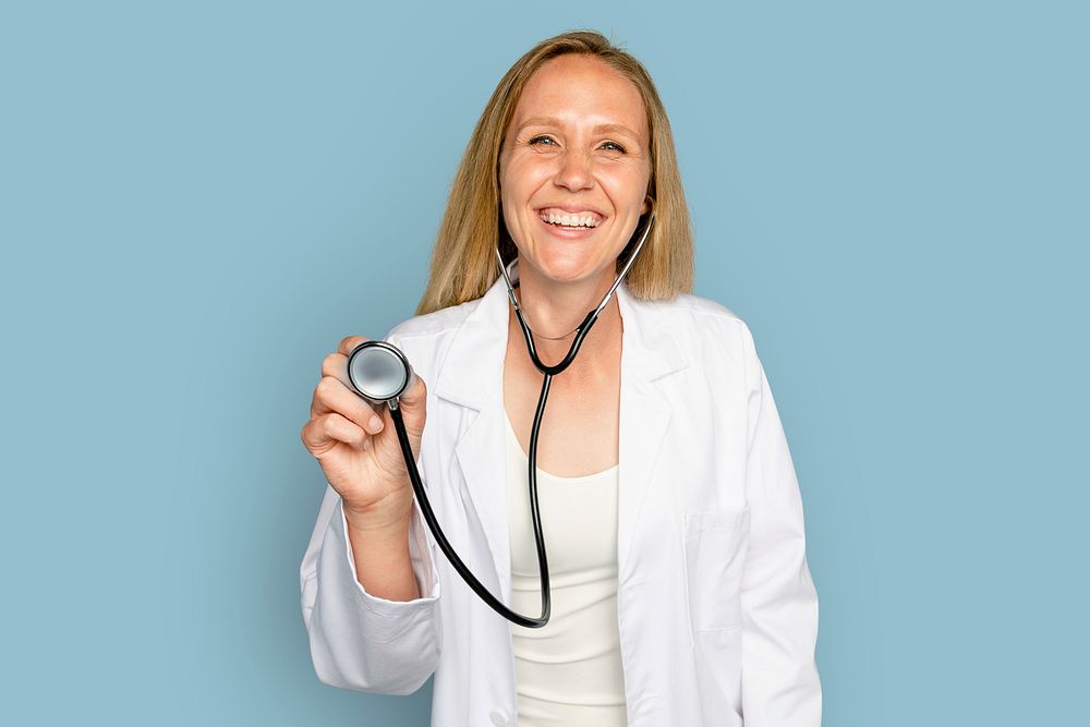 Cheerful woman doctor using stethoscope
