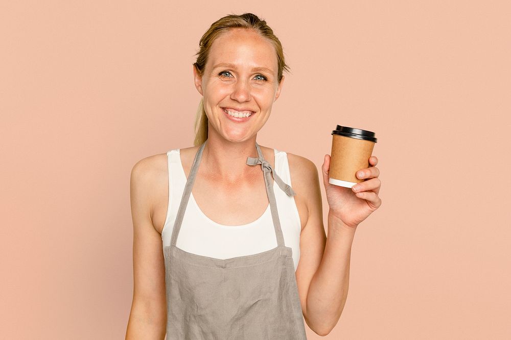Business owner woman mockup psd holding coffee cup