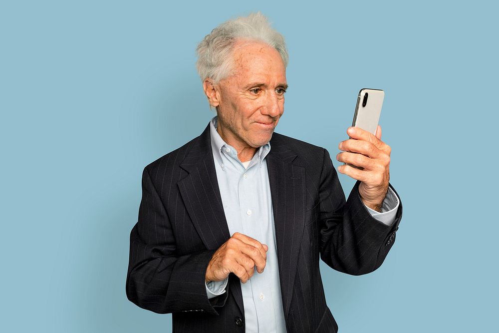 Senior man mockup psd video calling on smartphone digital device
