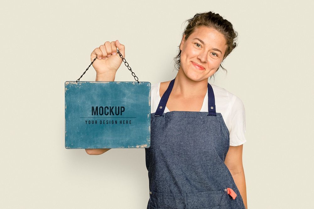 Hanging chalkboard sign mockup psd for cafe held by a woman small business owner