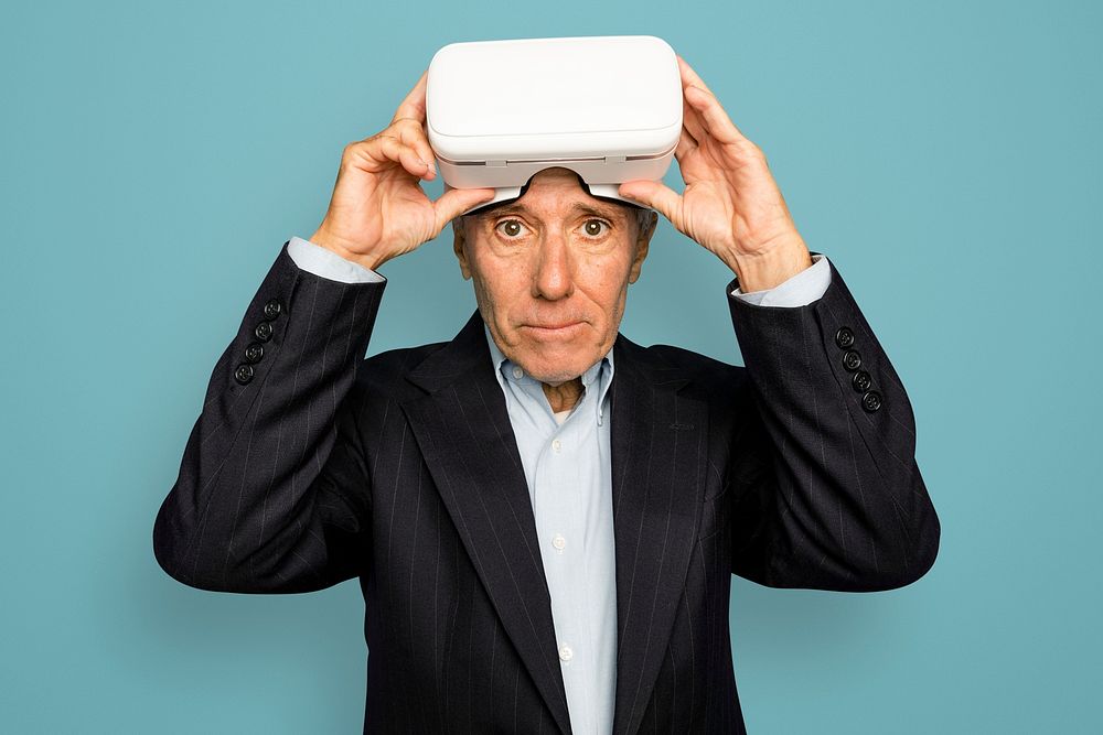 Senior man mockup psd wearing VR headset digital device
