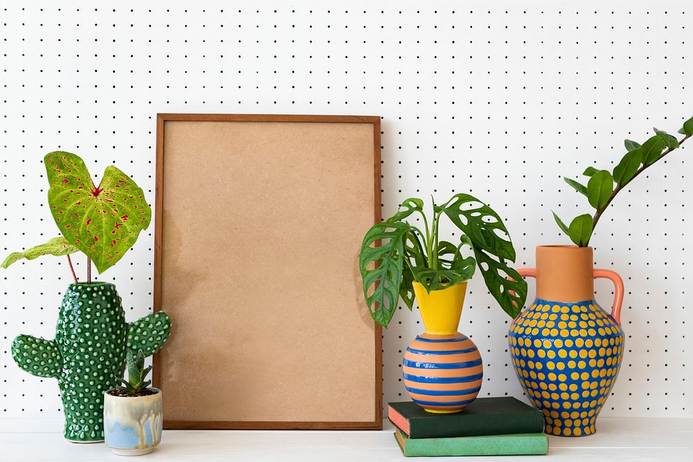 Blank frame on plant shelf home decor ideas