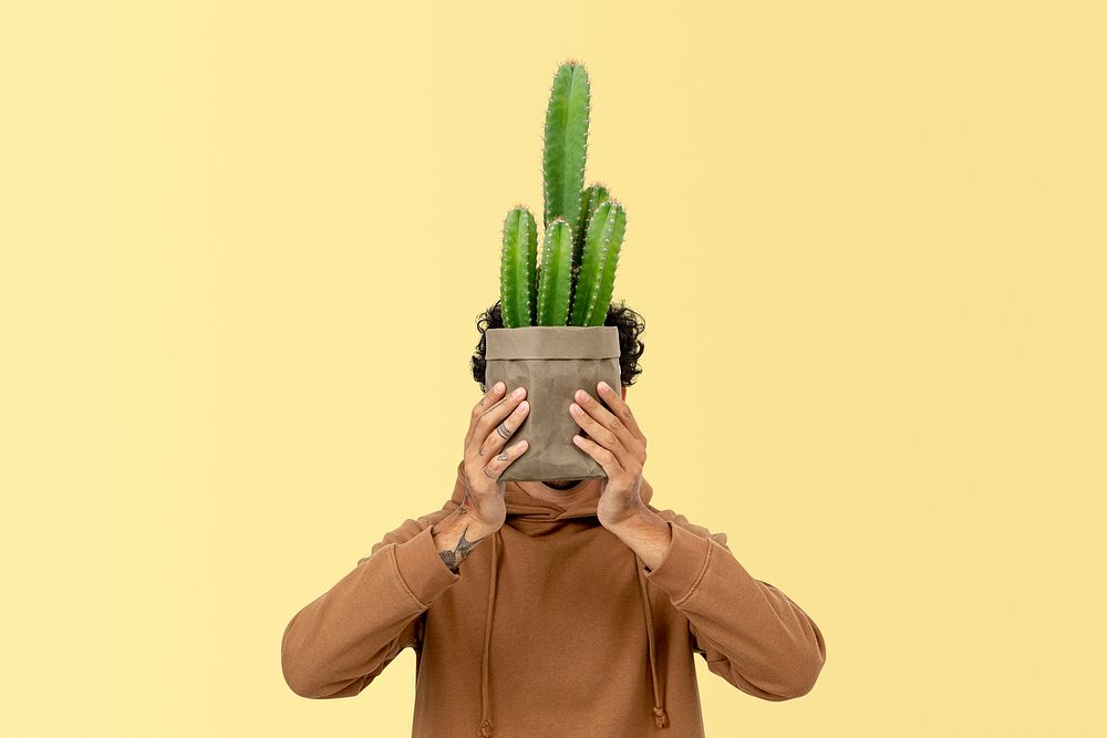 Plant parent mockup psd holding potted cereus cactus