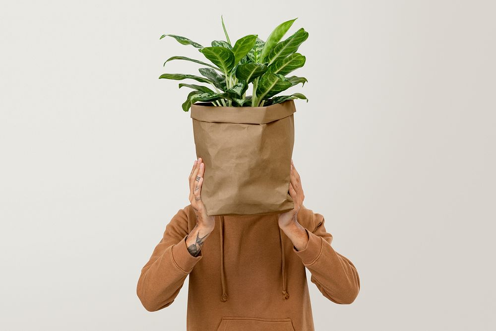 Plant lover mockup psd holding potted dumb cane