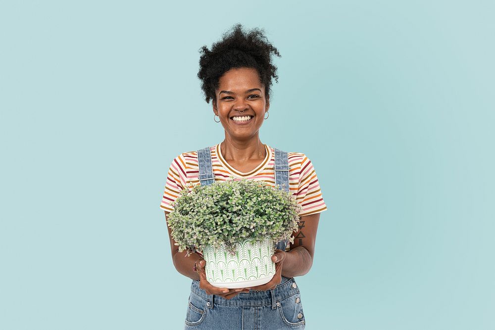 Plant lady mockup psd holding potted shrubs