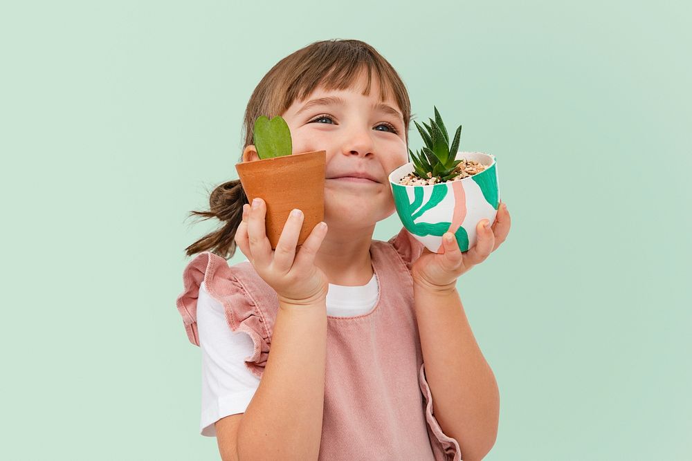 Little girl mockup psd with small succulent houseplant