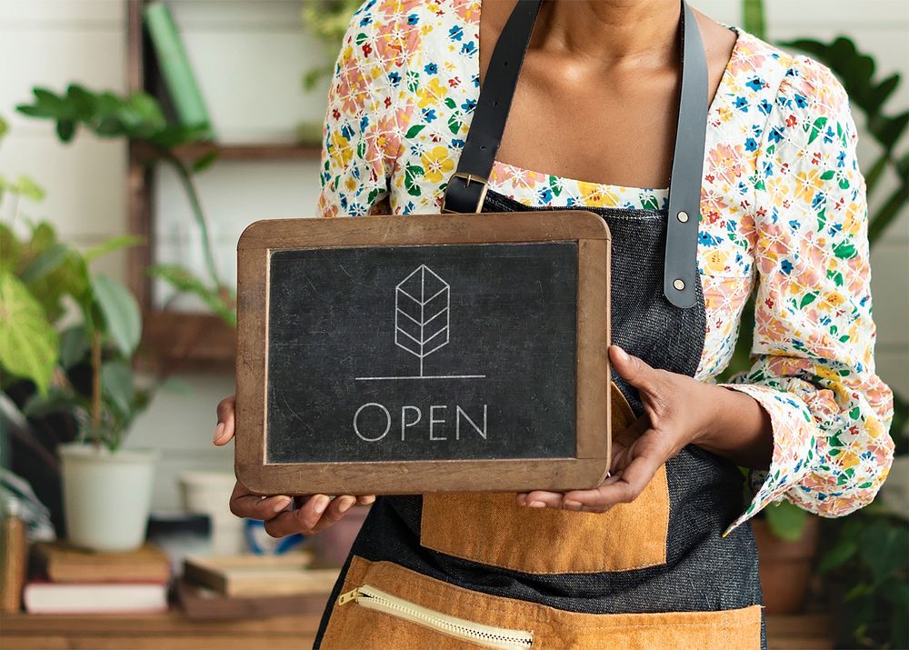 Blackboard sign mockup psd with plant shop owner