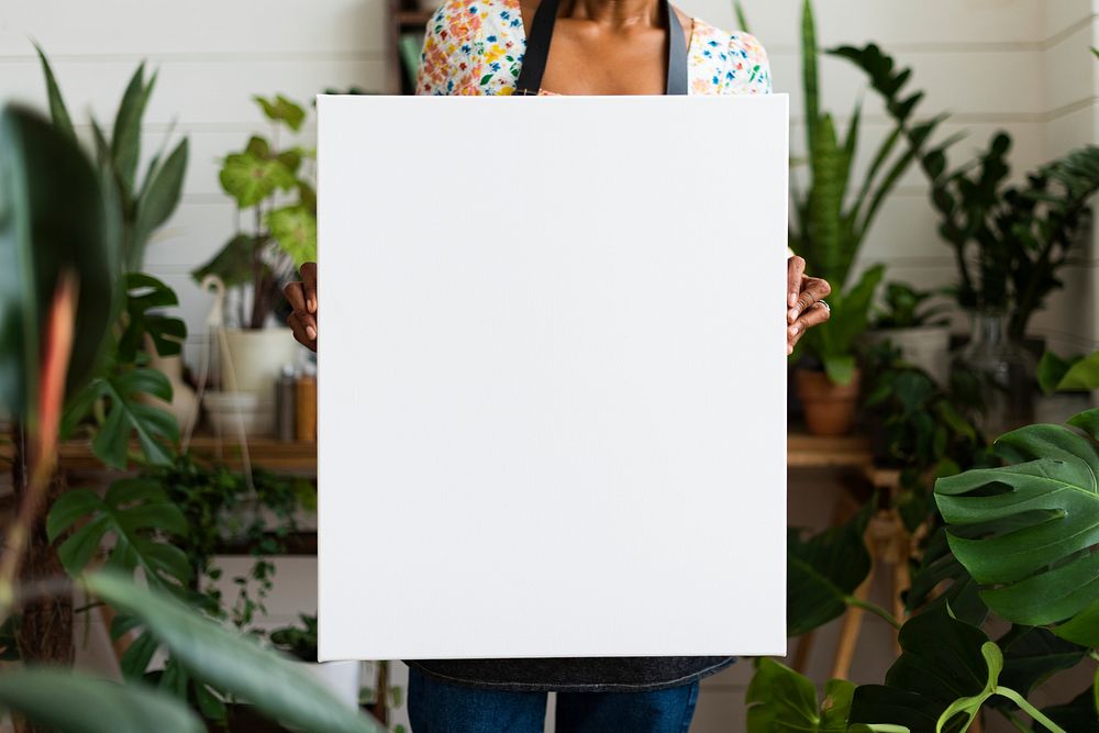 Small business owner holding a blank sign 