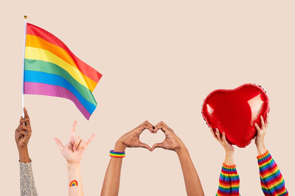 LGBTQ+ pride celebration with hand and crowd cheering