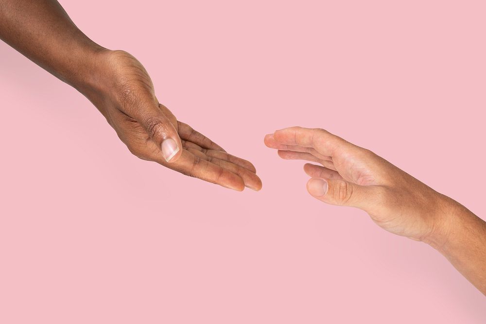 Helping hands reaching charity gesture