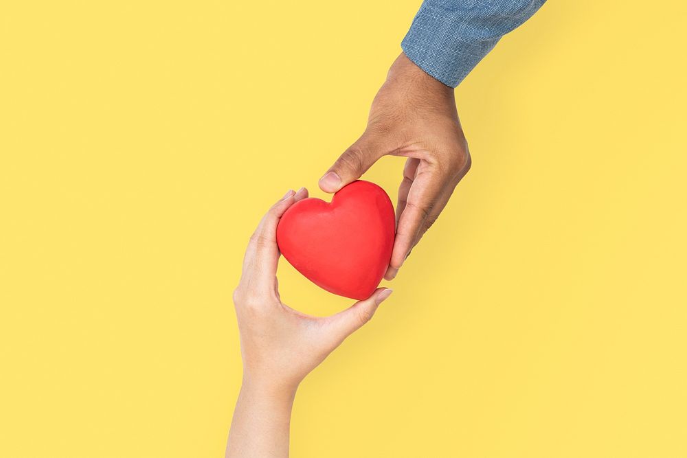 Hands holding heart mockup psd in love and relationship concept