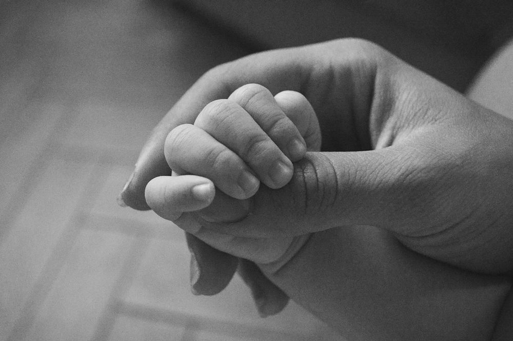 Newborn gripping or grasping. Original public domain image from Wikimedia Commons