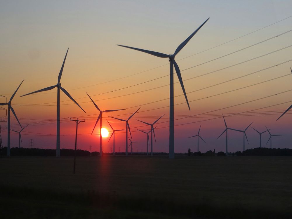Wind farm at sunset. Original public domain image from Wikimedia Commons
