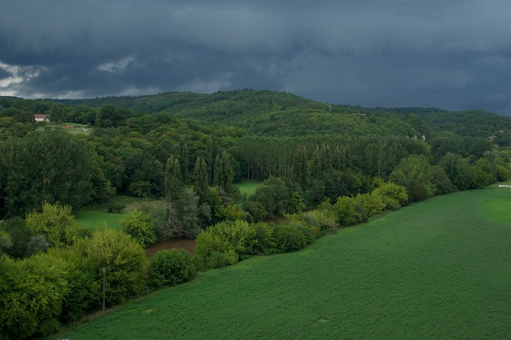 Stormy weather over the Vézère River, in Dordogne, France. Original public domain image from Wikimedia Commons
