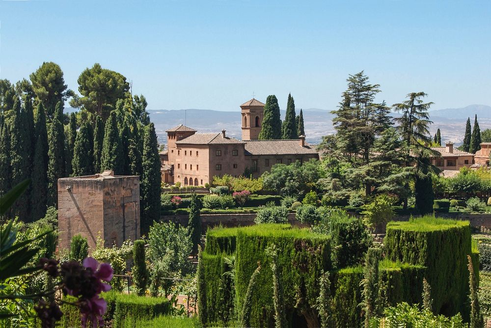 A tower, the gardens, and the convent of San Francisco, now the Parador of the city, Alhambra, Granada, Spain. Original…