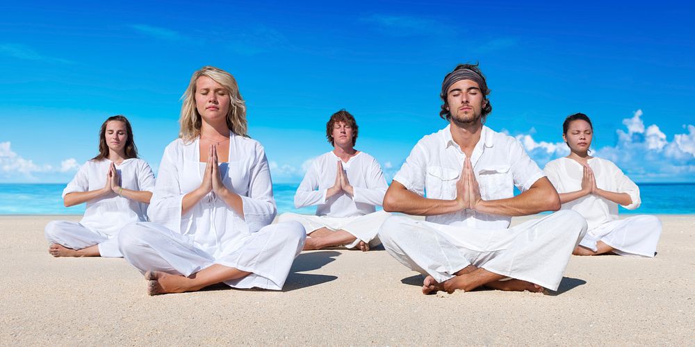 A group of people is meditating
