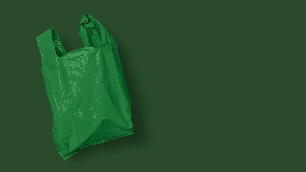 Single use green plastic bag background