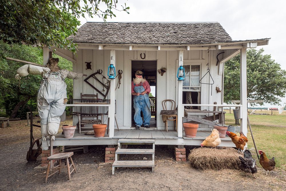 "Uncle Bob" Beringer, a historical interpreter, is photographed on an authentic early-Texas sharecropper's cabin on the…