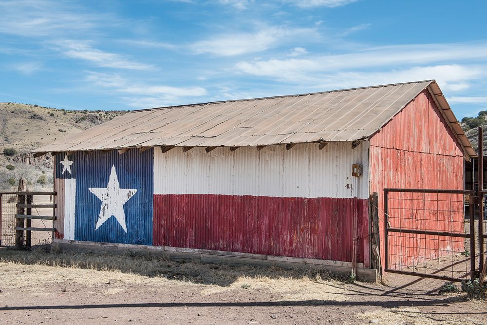 Metal side of a barn, decorated with a painting of the Flag of Texas, near Fort Davis in Jeff Davis County, Texas. Original…