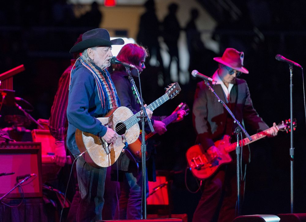 Country singer-songwriting legend Willie Nelson, age 80 at the time of this photograph, performs with his band, "Family," at…