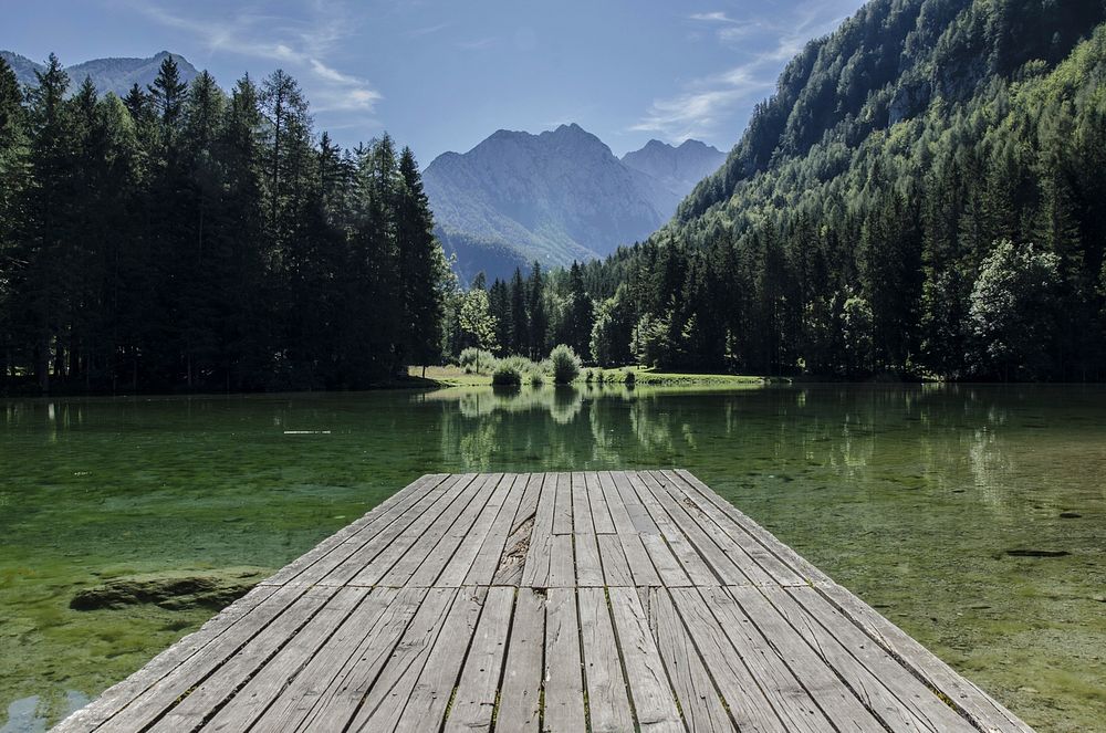 Wooden dock by a clear lake. Original public domain image from Wikimedia Commons