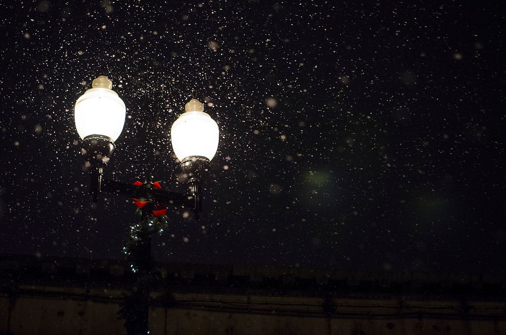 Twin lamp post lanterns on snowy night. Original public domain image from Wikimedia Commons