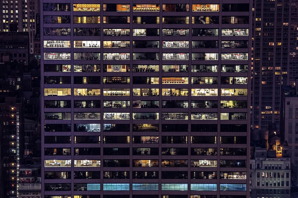 Lights in the windows of an office building in Manhattan in the evening. Original public domain image from Wikimedia Commons