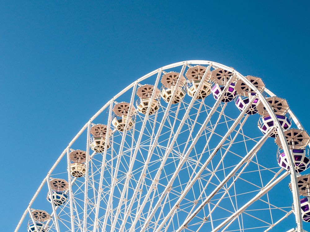 Ferris Wheel with blue sky. Original public domain image from Wikimedia Commons