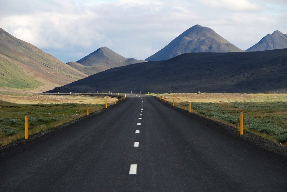 A curve in an empty asphalt road in the highlands. Original public domain image from Wikimedia Commons