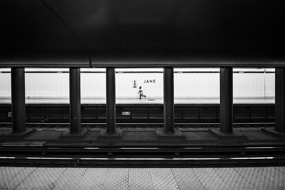 A person running on a subway platform after missing the train. Original public domain image from Wikimedia Commons