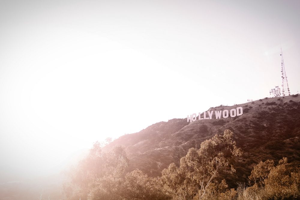 Bright white sunset next to the Hollywood sign. Original public domain image from Wikimedia Commons