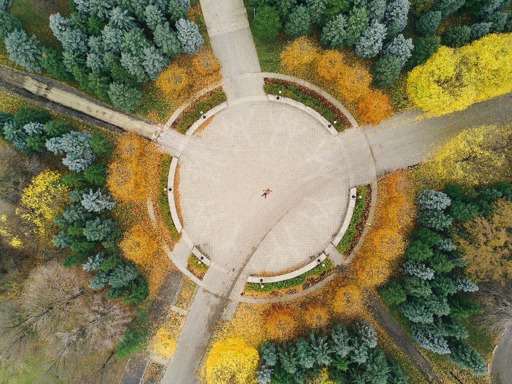 Roundabout in an autumnal park drone shot. Original public domain image from Wikimedia Commons