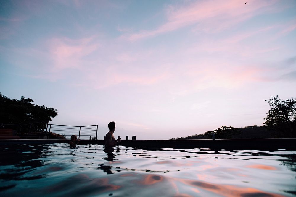 Man swimming under purple sky. Original public domain image from Wikimedia Commons