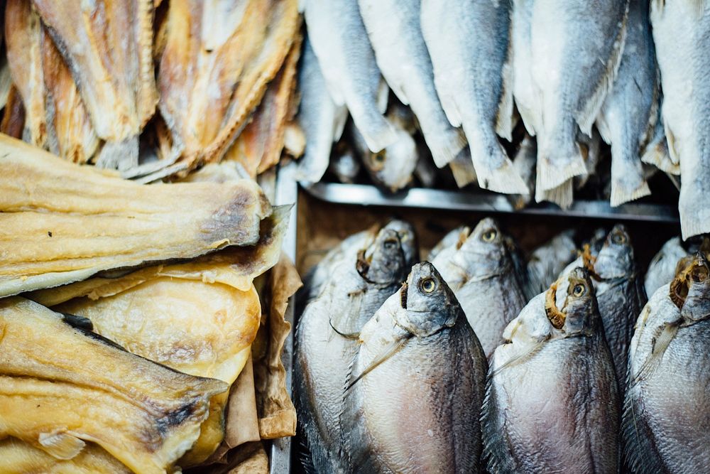 Fresh fish neatly stacked in crates at a fish market. Original public domain image from Wikimedia Commons