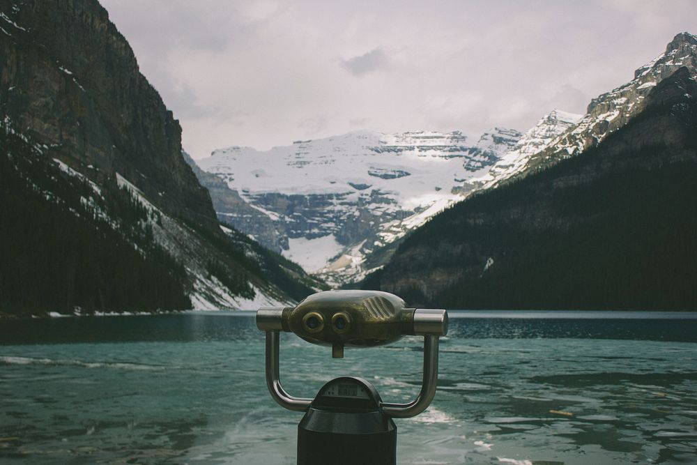 A tower viewer on the shore of a turquoise mountain lake. Original public domain image from Wikimedia Commons